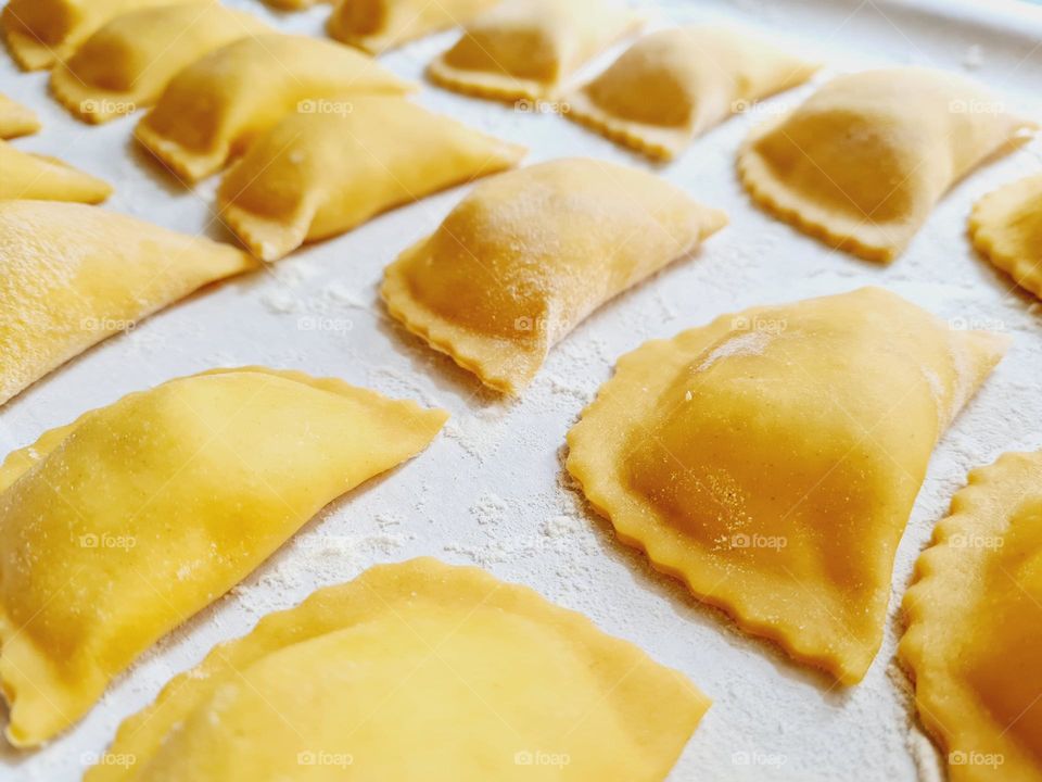 closeup of handmade ravioli with ricotta