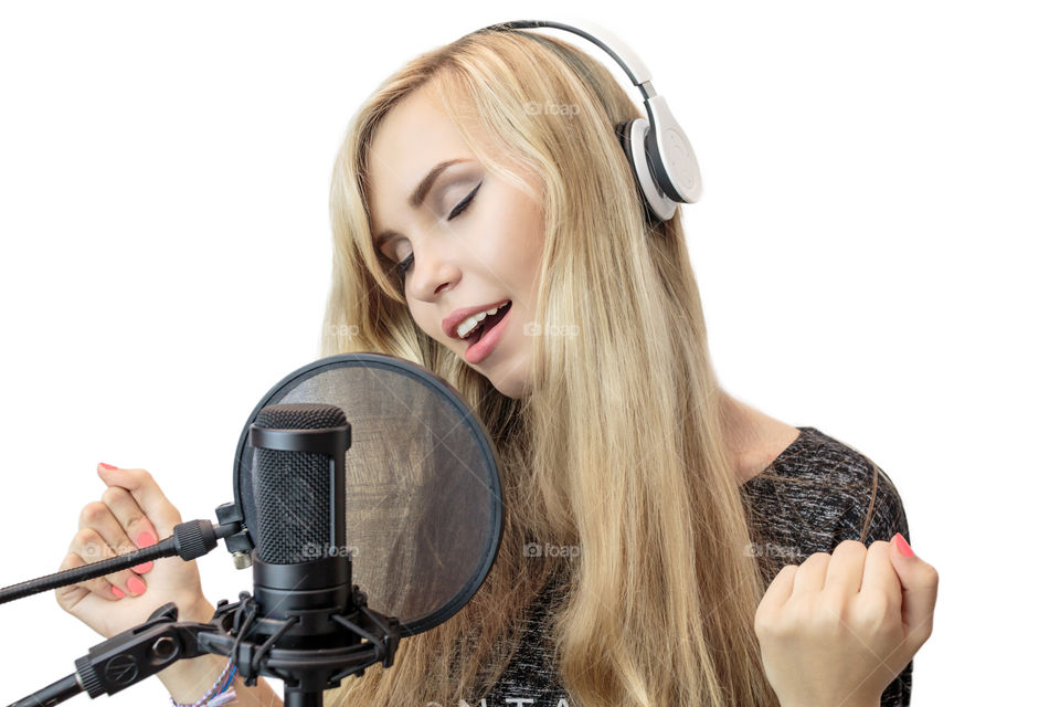 girl singing into a microphone