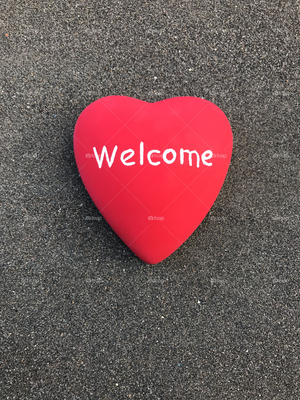 High angle view of welcome text on heart shape