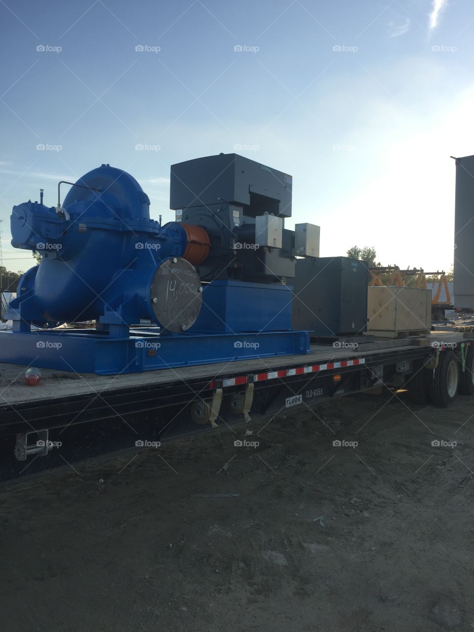 Crystal River, Florida, LNG Power plant Construction Oct/2017 to Dec/2017 Flatbed trailer, how we moved construction equipment in place for the crane to grab and set in place. Large pump on trailer.