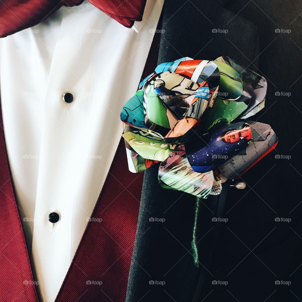 Comic book rose as a corsage on a men’s suit jacket.