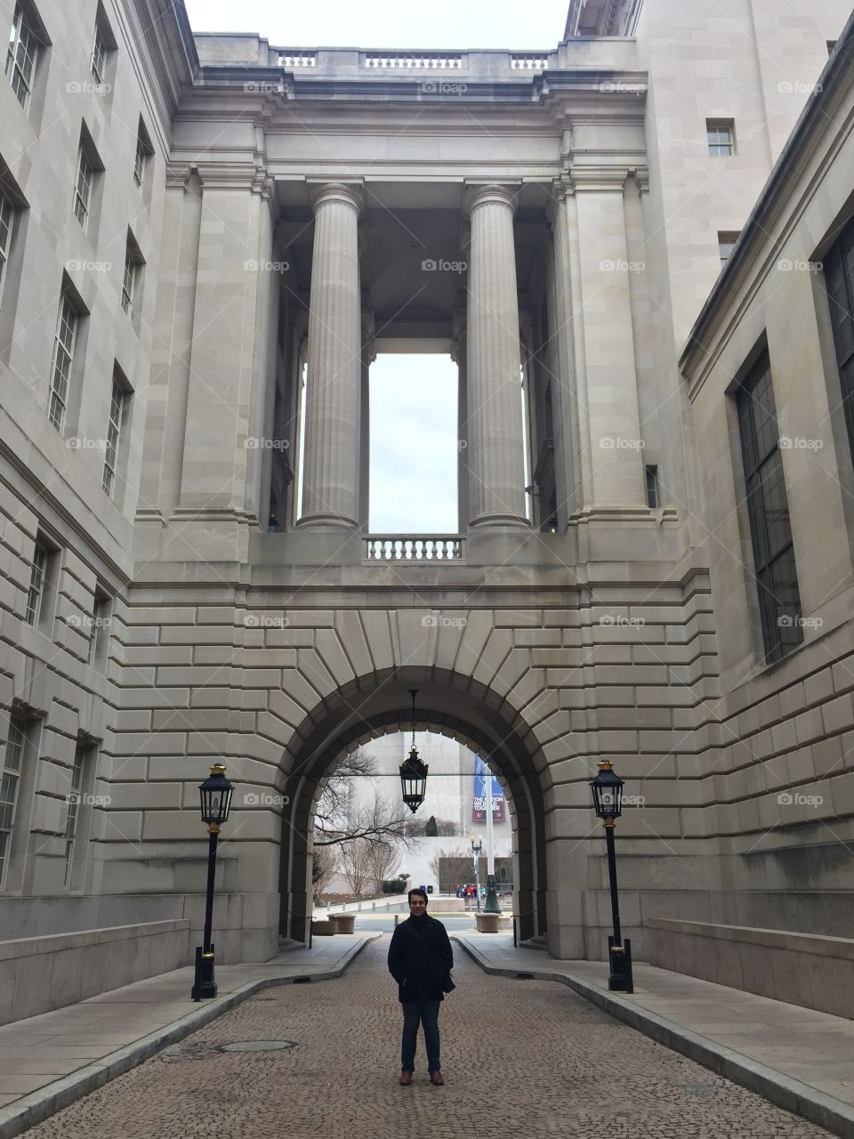 Man standing in front of the building