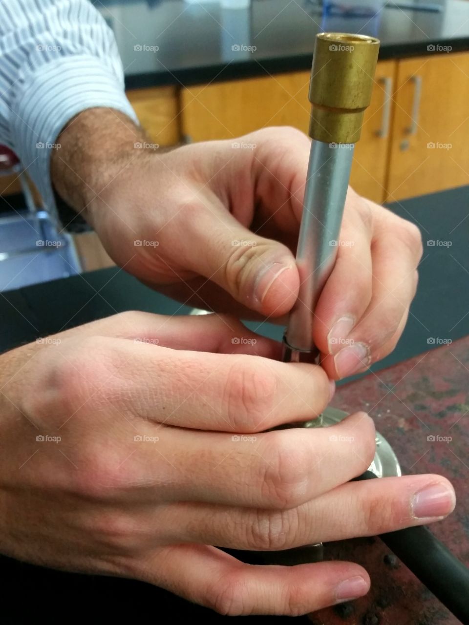 adjusting a bunsen burner