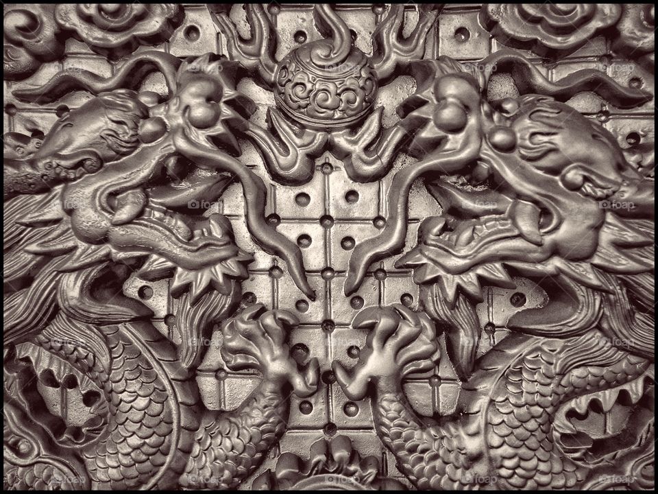 Enter the Dragon.

Detail of a hanging wall-art mural depicting chinese-style dragons. 