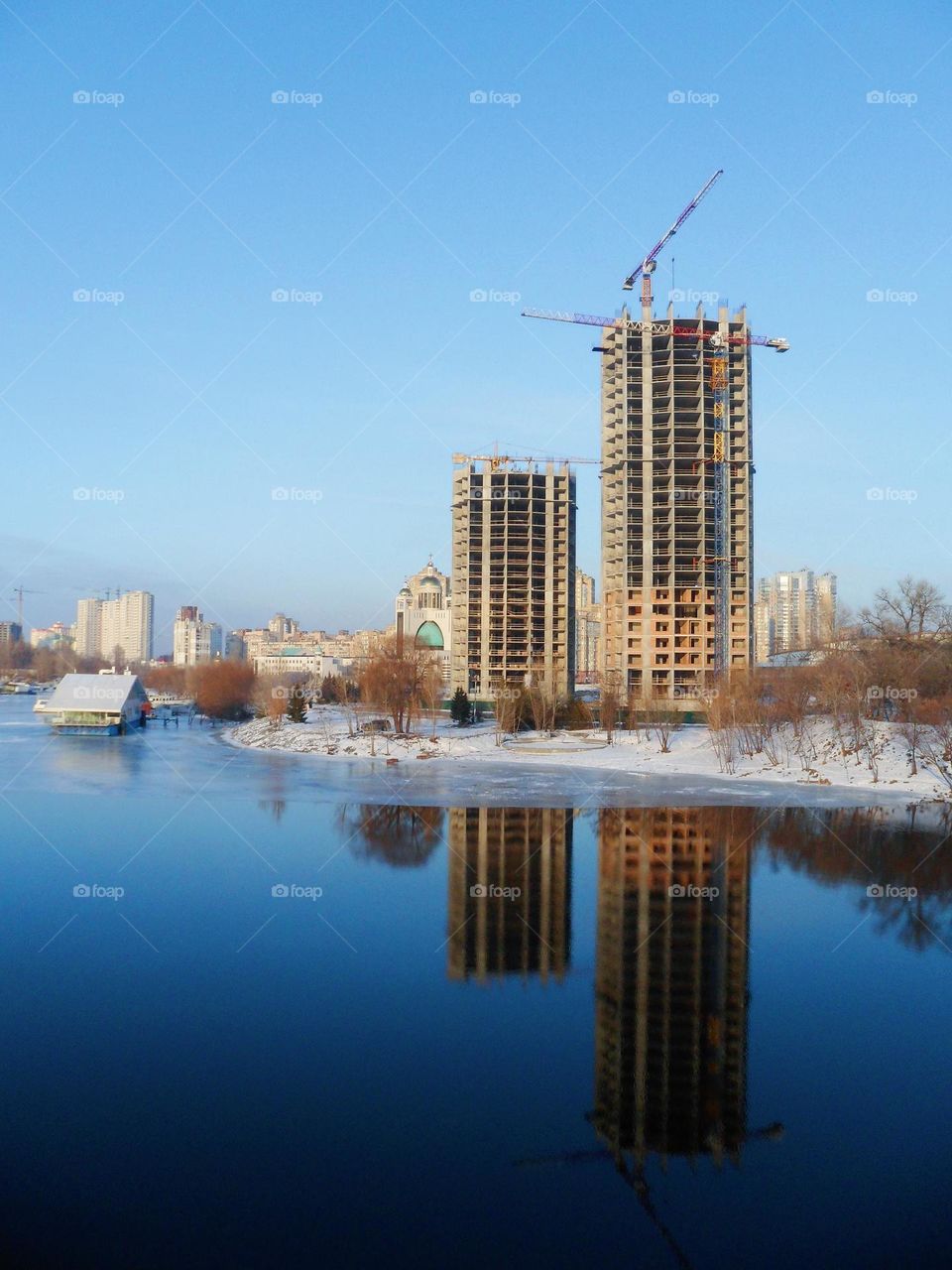 mirror reflection on the water of the houses