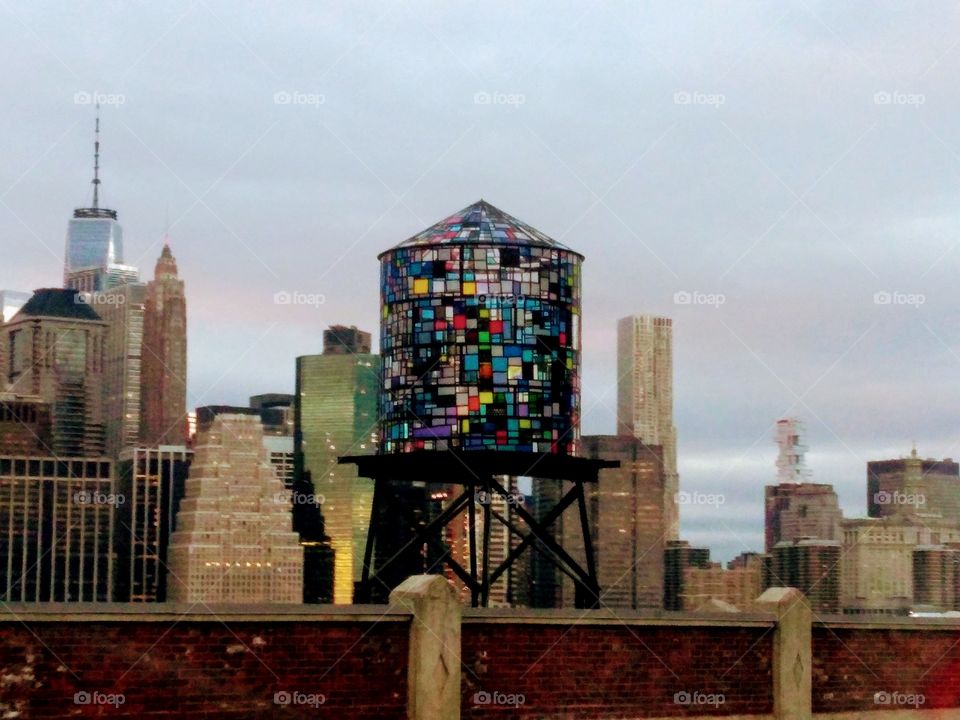 Stain glass art tower over NYC skyline