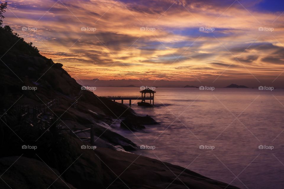 Break of Dawn at the Coastline of Long Chao Kok, East coast of Macau SAR. A Beautiful color Combinations Coming from the Sky.,