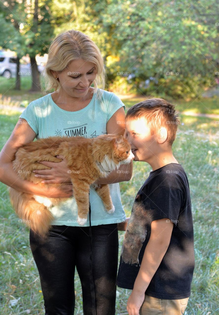 family mother and child boy and cat, love pet