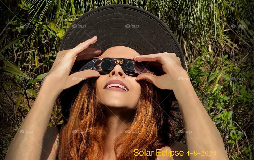 Woman enjoying the Solar Eclipse safely.