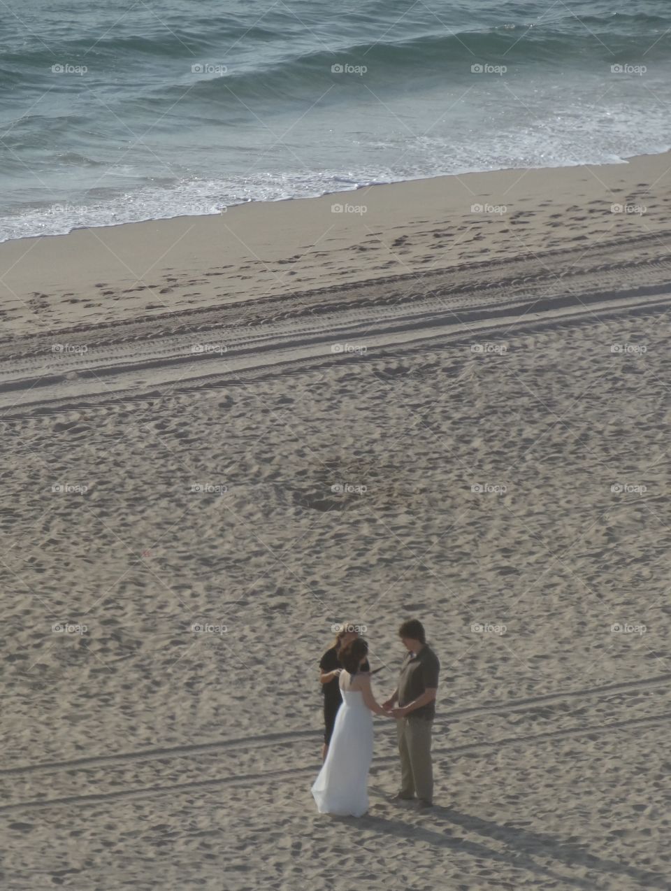 Wedding on the beach in Florida. A wedding we saw taking place on the beach in Florida, from our hotel window far above. 