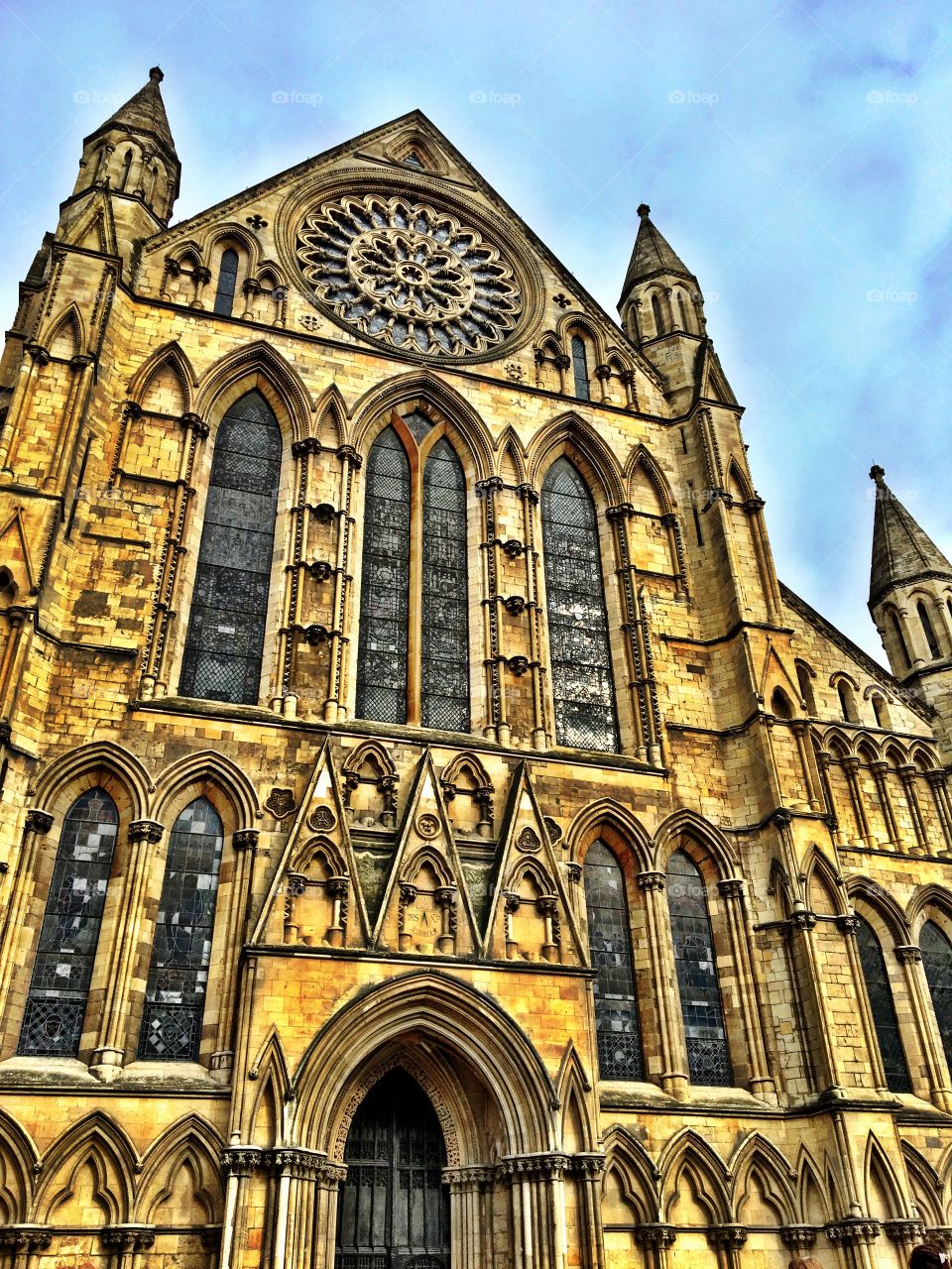 The famous front entrance to York Minster Cathedral with beautiful architecture and stained glass windows. 