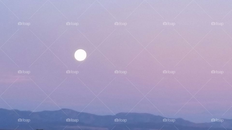 summer moonrise over the mountains