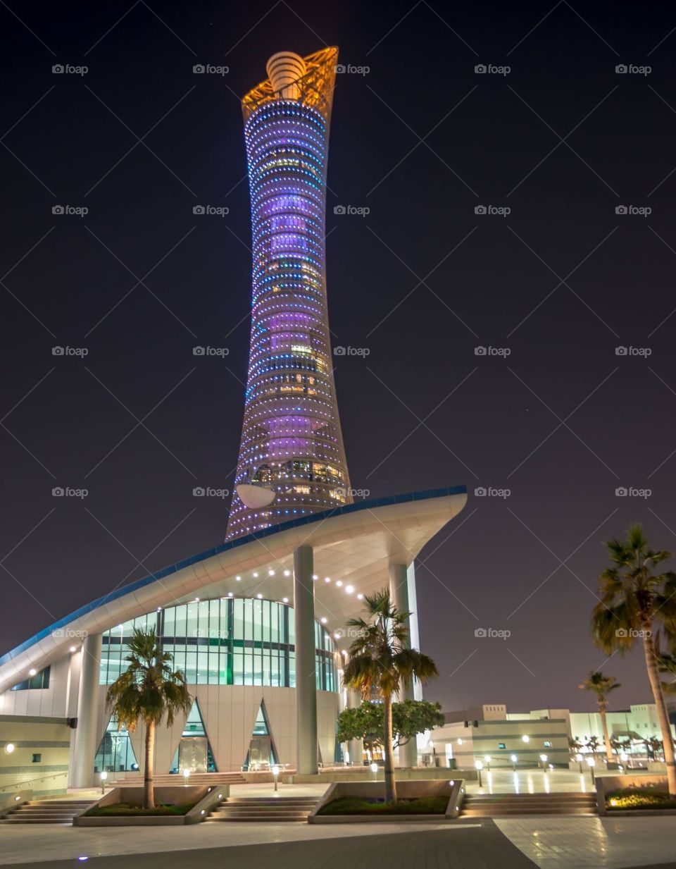 Torch tower behind mosque 