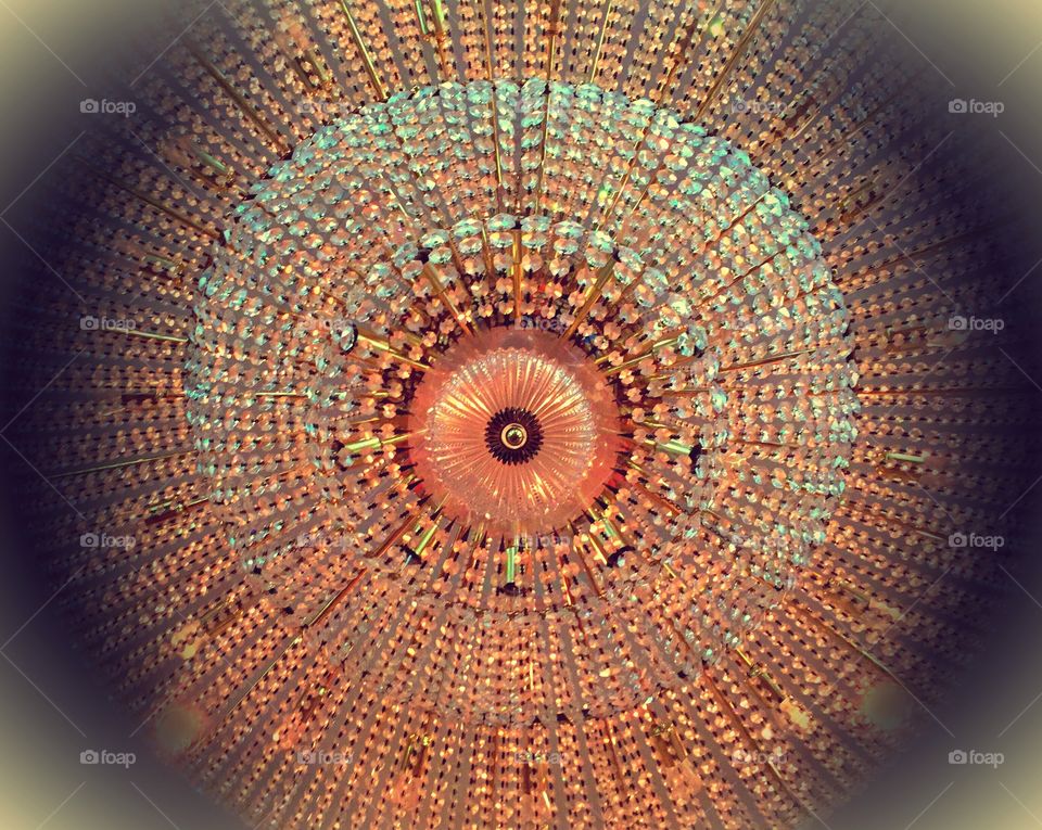 Vintage chandelier. Looking up at a sparkling , vintage chandelier .