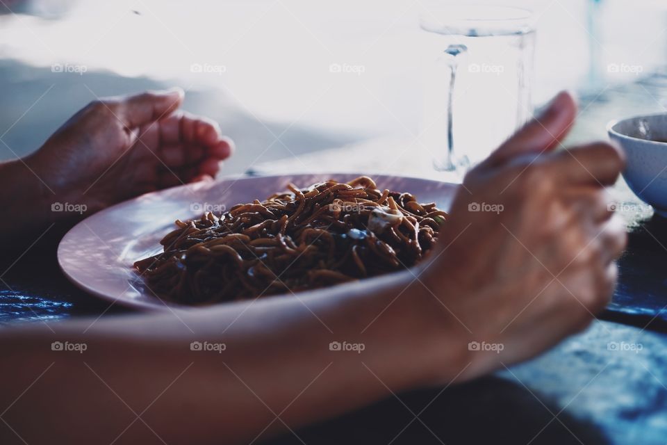 Eating fried noodles 