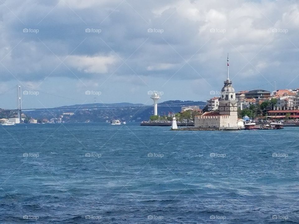 a bridge in Istanbul Turkey,  light house, city, etc