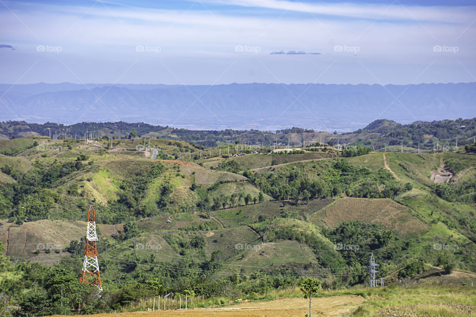 High voltage transmission towers on the Moutain and ksy at Khao Kho of phetchabun in Thailand.