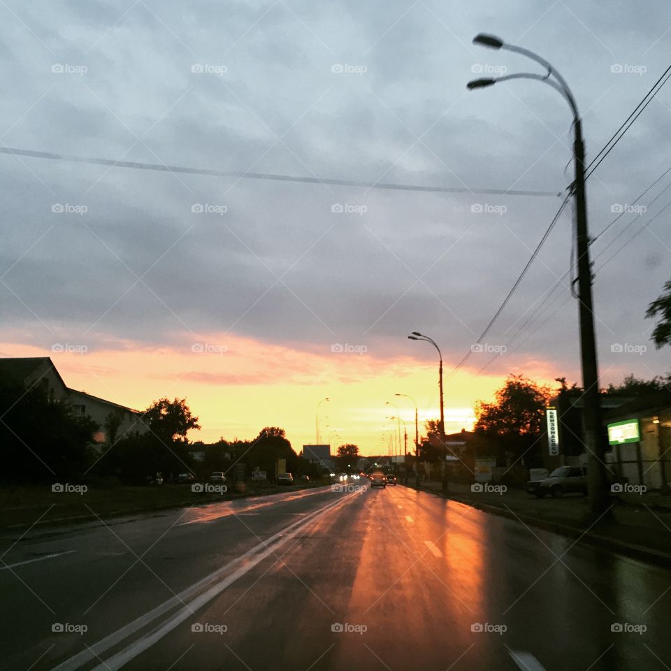 Sunset on a road after rain