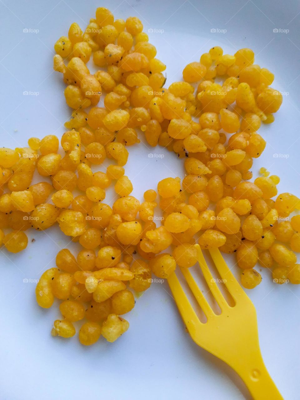 Yellow Colored Sweet with a fork as a flower pattern