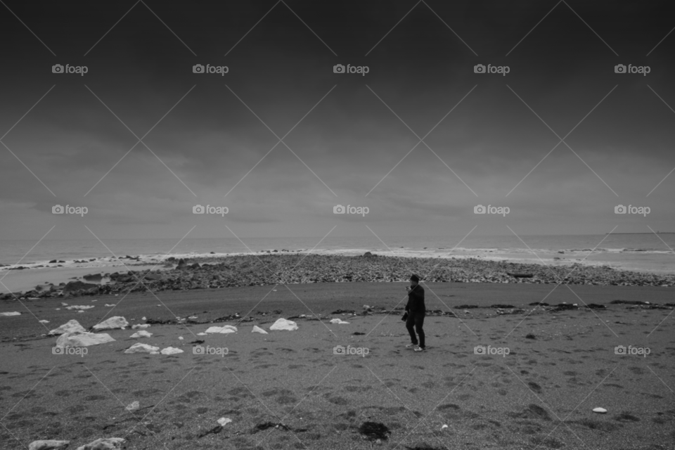 beach stones man sea by leonbritton123