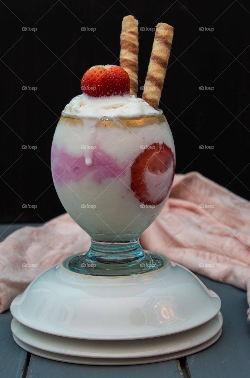 Vanilla and Strawberry Ice Cream with strawberry pieces and chocolate biscuits