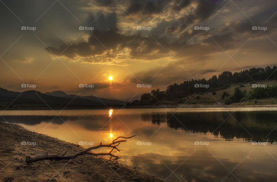 Reflection of sun in lake