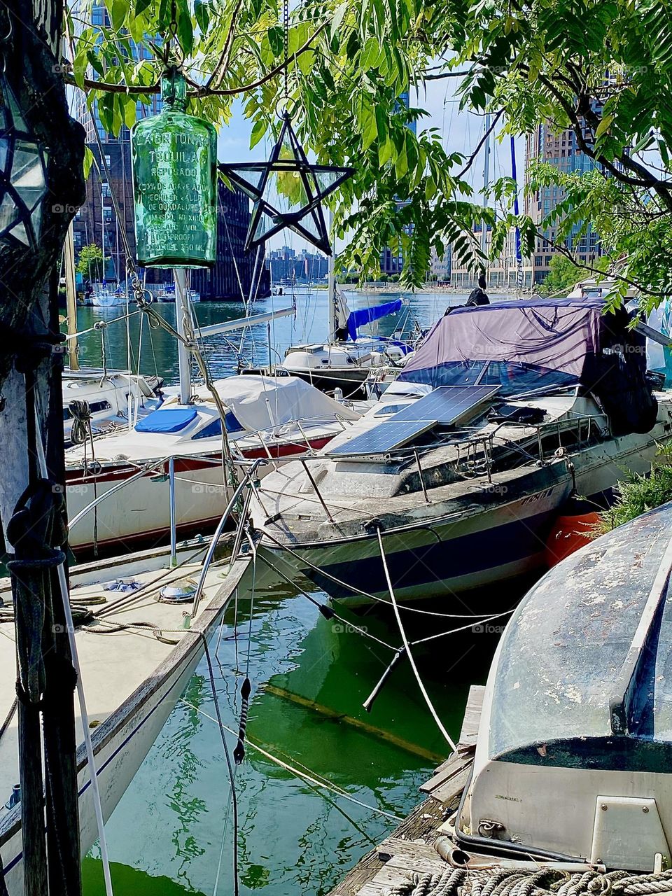 This is a charming view from the veranda on the LIC shore of the boats at  “Newtown Creek” by the “Pulaski Bridge” on a warm bright and sunny Indian summer afternoon in September 2023. Hypnotic Productions