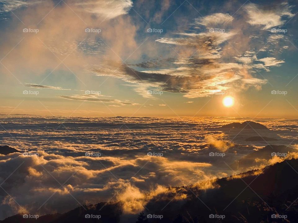 Beautiful mountain scenery with sun set and sea of clouds