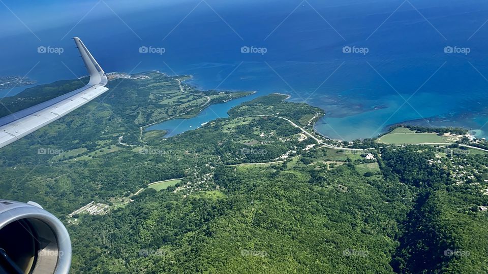 American Airlines Airbus A321 flying over Sandy Bay about to land at Sangster International Airport (MBJ) in Montego Bay Jamaica