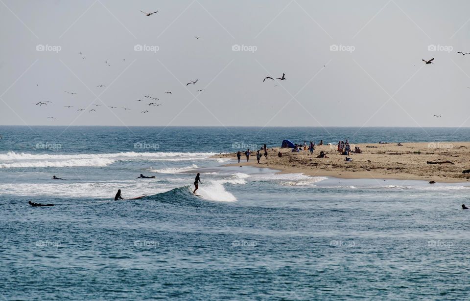 People surfing on the beach 