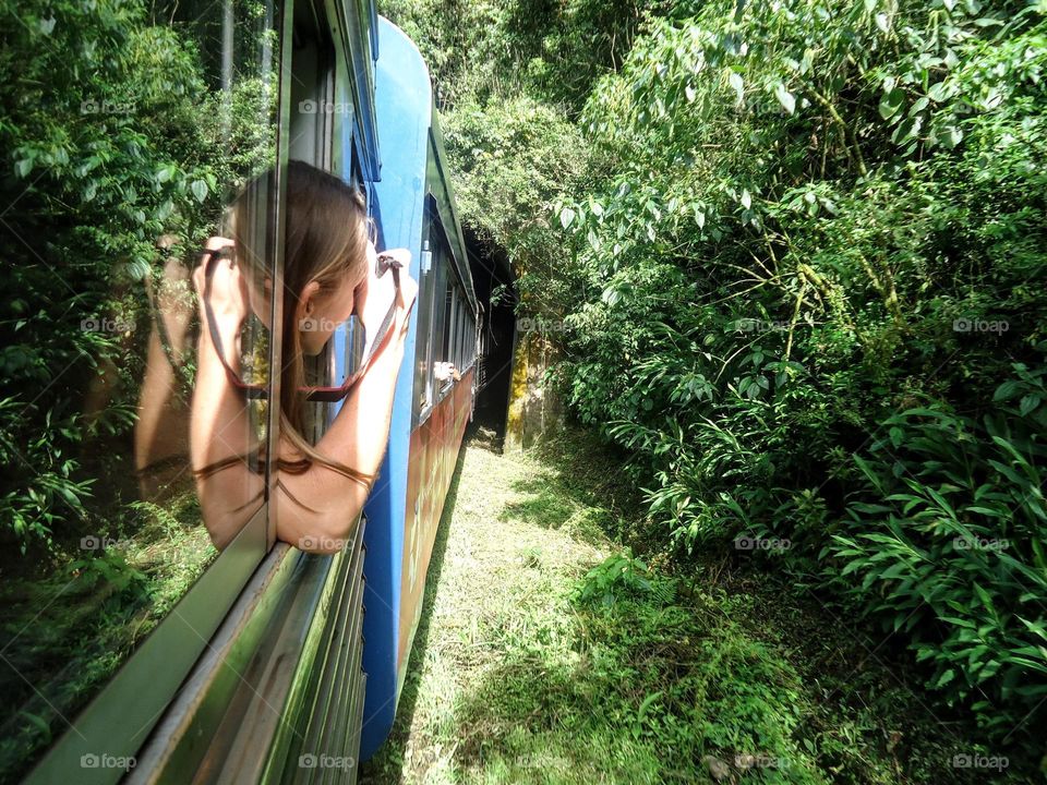 Woman photographing no the train