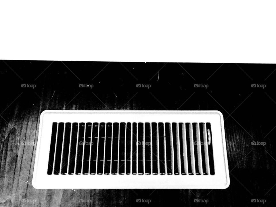 Black and white photo of floor register captures the rectangular shapes in the image! 