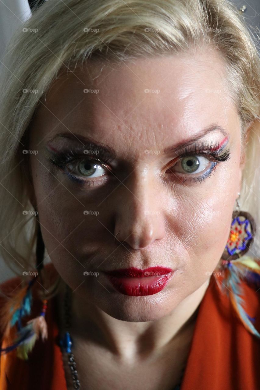 Portrait of a woman with Dutch flag make up