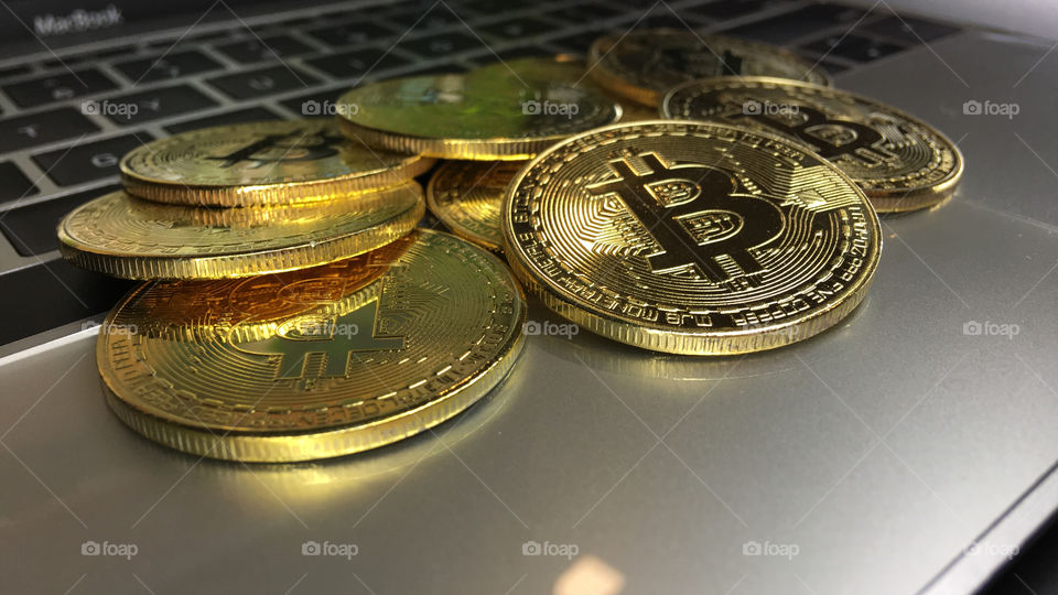 Close up on Gold bitcoin on keyboard 