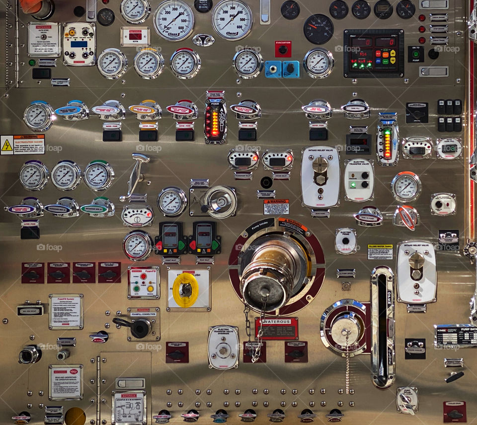 Closeup of gauges and dials on the side of a fire truck