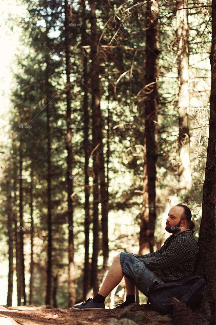 A man resting in the mountains on a halt