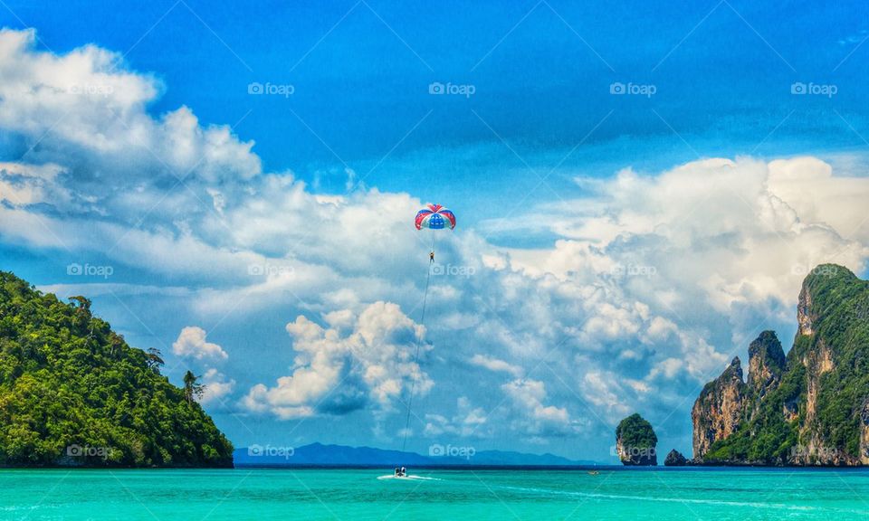 Parachuting above beautiful sea