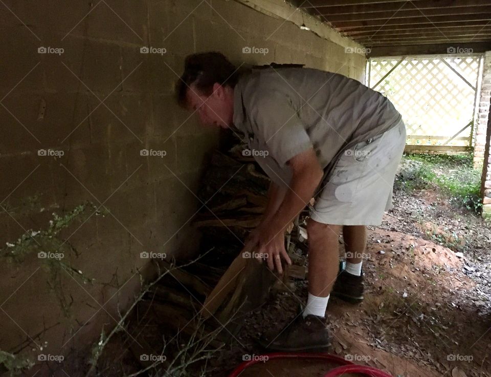 Man moving fire wood