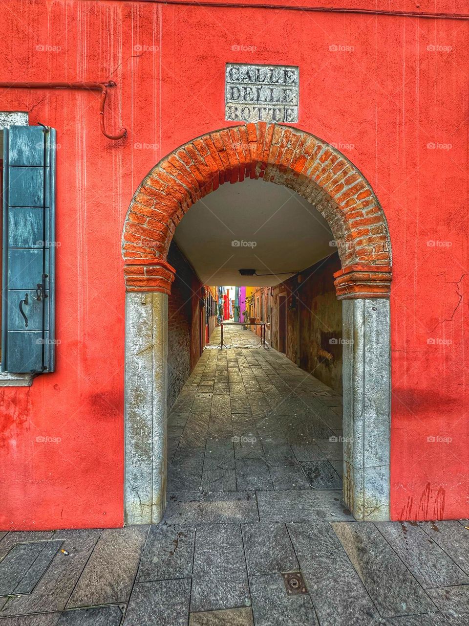 Red arch in Burano, Veneto, Italy 🇮🇹