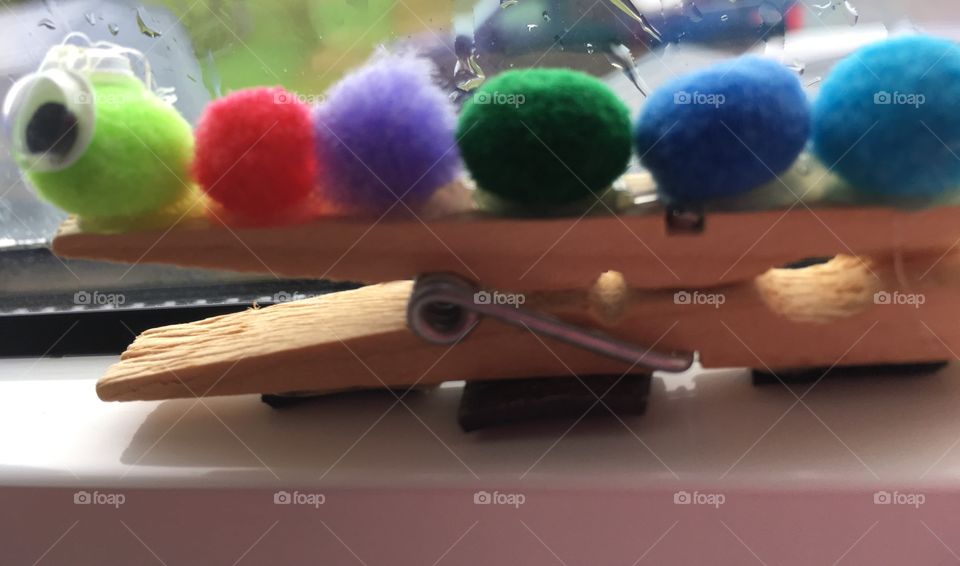 Caterpillar craft. Diy. Rainbow puff balls on wooden clothespin. 