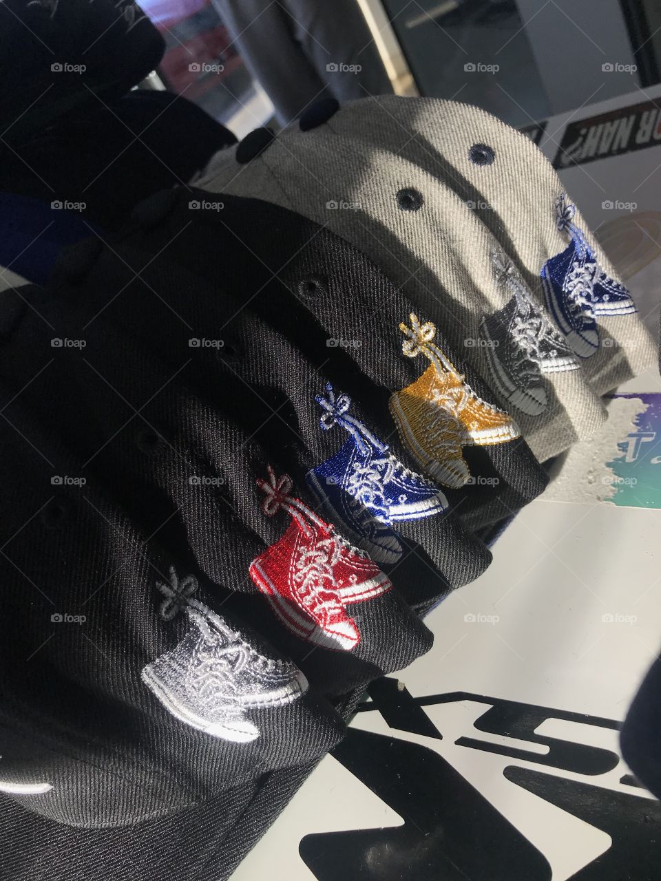 Different color shoes on hats