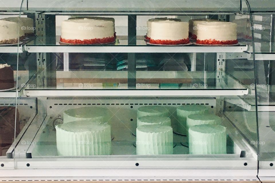 Whole cakes in glass showcase 