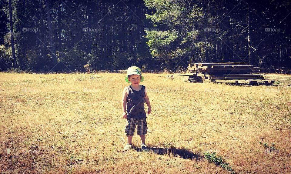 Red head toddler in a field