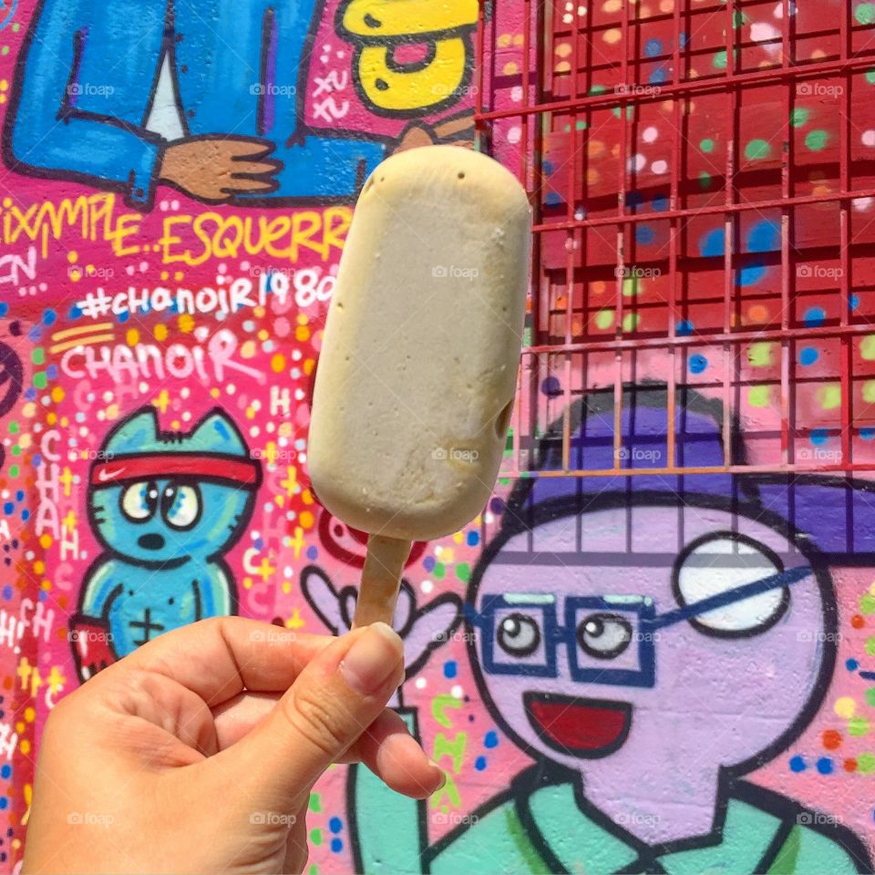 Pistachio Gelato Pop - Wynwood. The bright and beautiful graffiti art in Wynwood, Miami as the backdrop for a delicious organic gelato pop.