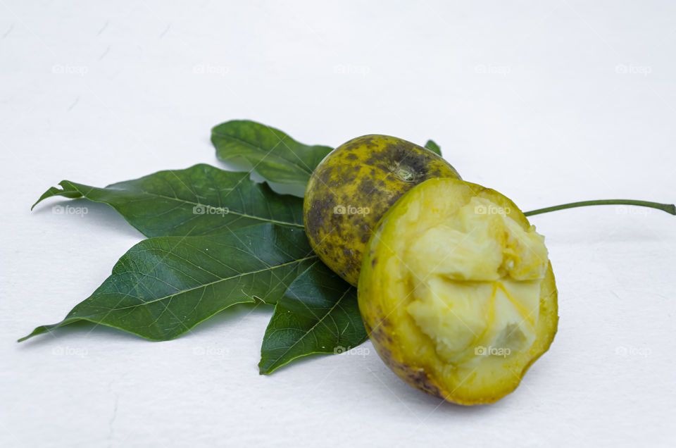 White Sapote Cut And Whole Fruits On Leaves