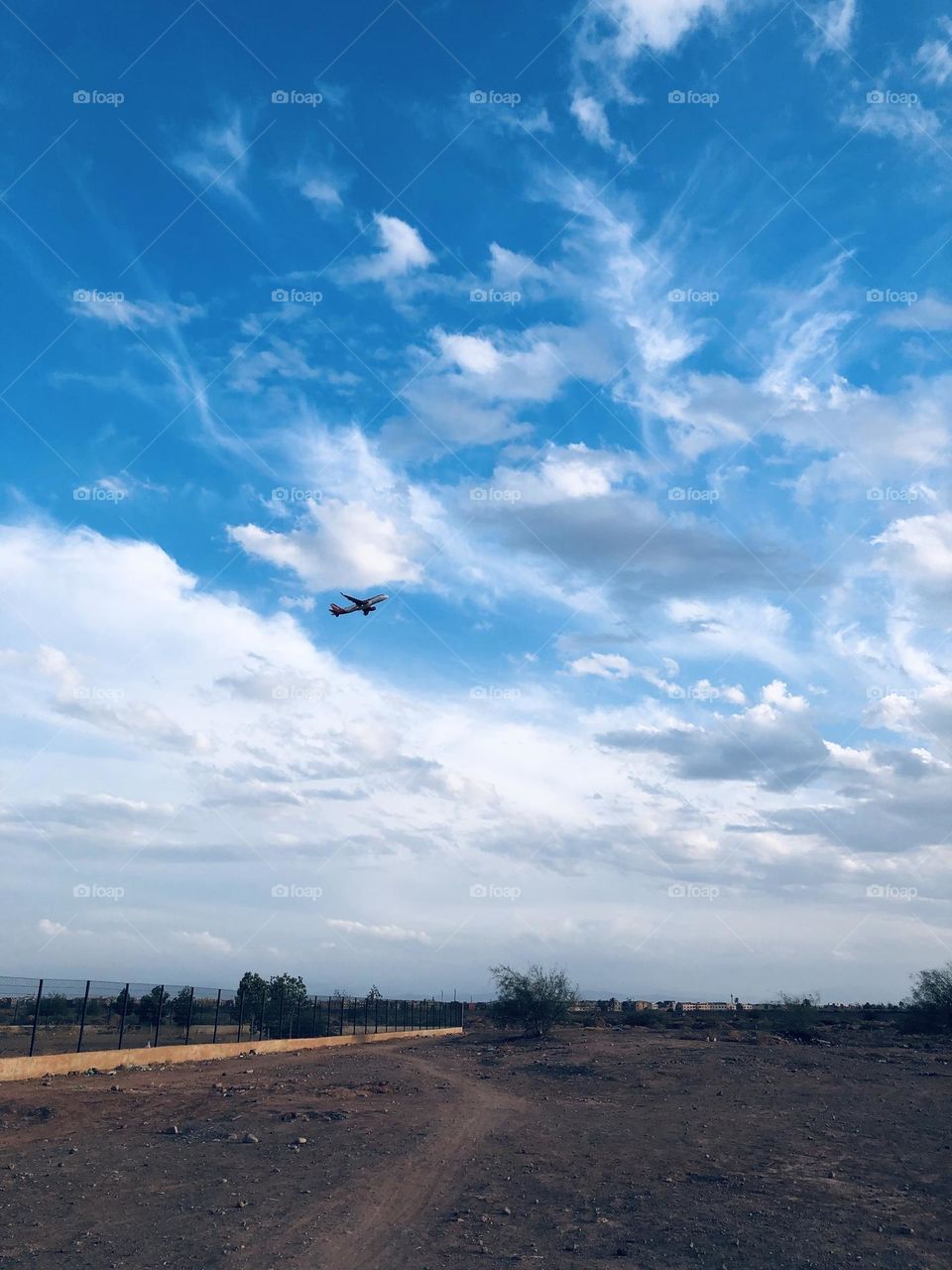 Flying airplane cross the foggy sky 