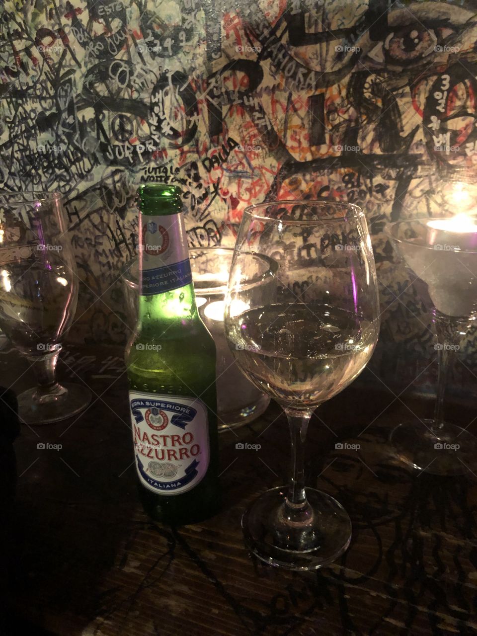 Italian beer and wine in front of graffiti 