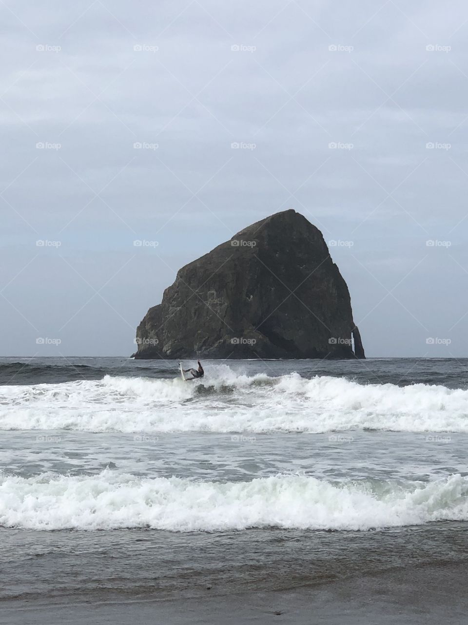 Surfer at Haystack Rock
