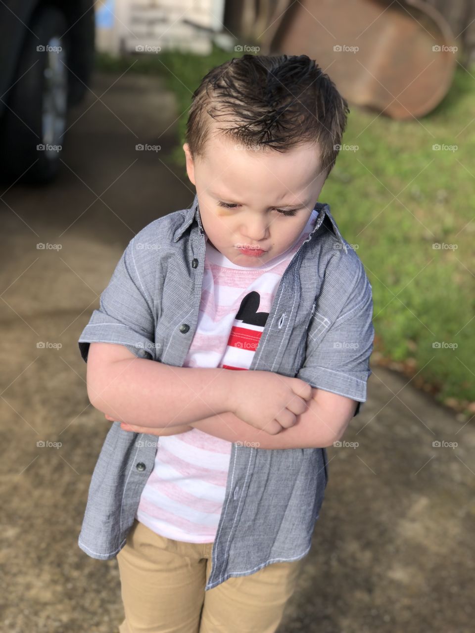 toddler boy outside, modeling the pouty lip, grumpy model 
