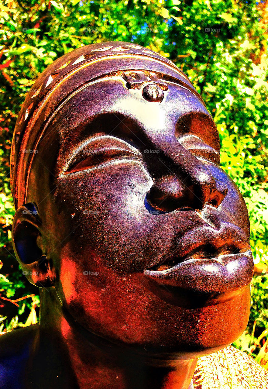 Profile of face on sculpture of proud African Masai tribesman warrior